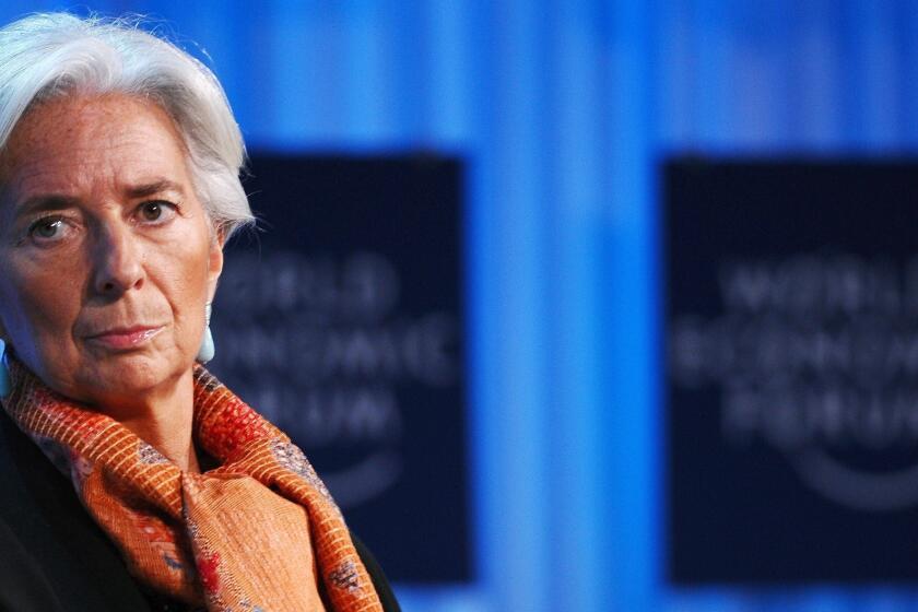Christine Lagarde, managing director of the International Monetary Fund. French police searched her Paris home Wednesday in connection with a probe of her handling of a high-profile scandal when she was a French government minister.