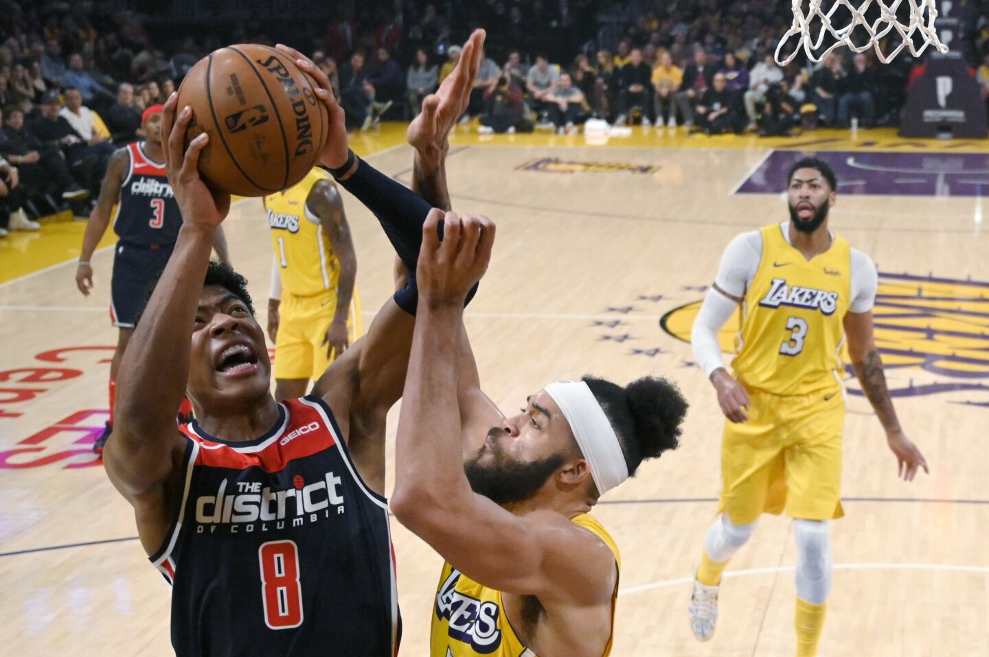 Wizards forward Rui Hachimura puts up a shot against Lakers center JaVale McGee during the first half of a game Nov. 29 at Staples Center.