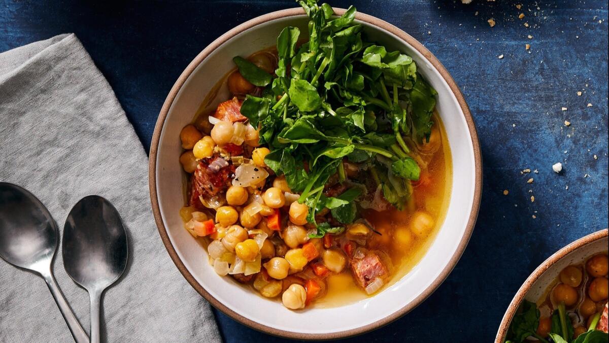 Chickpeas, baked in chicken broth with aromatics, become soft and tender, the perfect compliment to bracingly assertive lemony watercress. Food styling by Ben Mims, with Julie Giuffrida. Shot at Proplink Tabletop Studio in downtown Los Angeles.