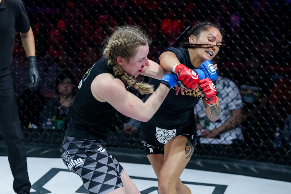 Ilima-Lei Macfarlen of La Mesa, shown punching challenger Kate Jackson during Bellator 236 on Dec. 21 in Honolulu.