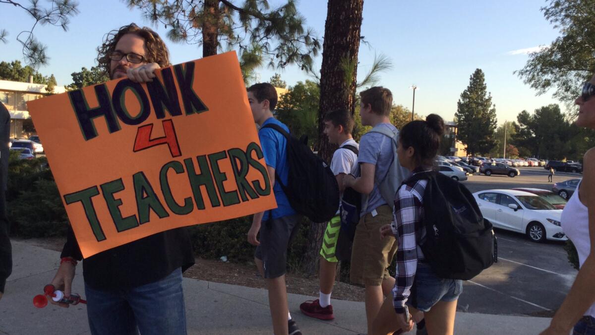 Teachers at El Camino Real Charter High School take part in a recent demonstration as students arrive for classes.