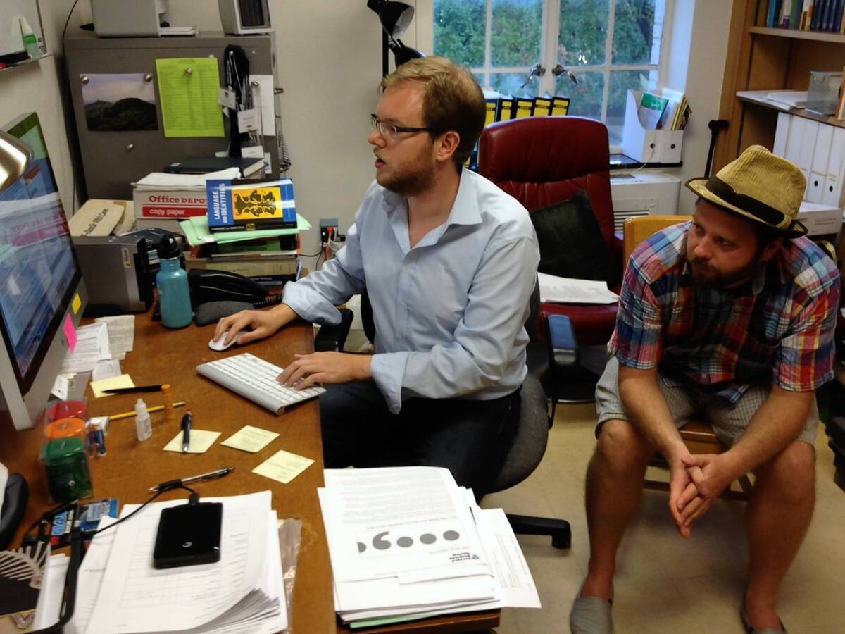 Lars Hinrichs, left, an assistant professor of English at the University of Texas, works with doctoral student Axel Bohmann on research into how Texas' regional dialect is changing.
