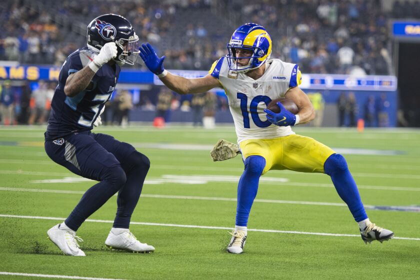 Los Angeles Rams wide receiver Cooper Kupp (10) runs with the ball during an NFL football game against the Tennessee Titans Sunday, Nov. 7, 2021, in Inglewood, Calif. (AP Photo/Kyusung Gong)