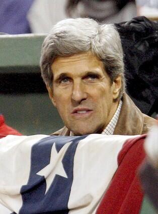 Massachusetts Senator John Kerry watches from the front row during Game 2 of the American League Championship Series.