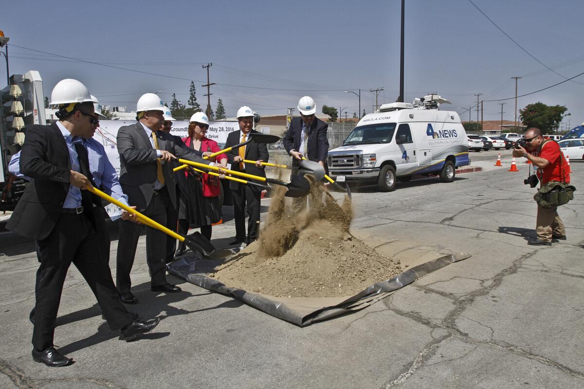 City of Burbank and Caltrans officials toss some dirt for the media during groundbreaking of the I-5/Empire Project at the corner of Buena Vista and San Fernando Rd. in Burbank on Wednesday, May 28, 2014.