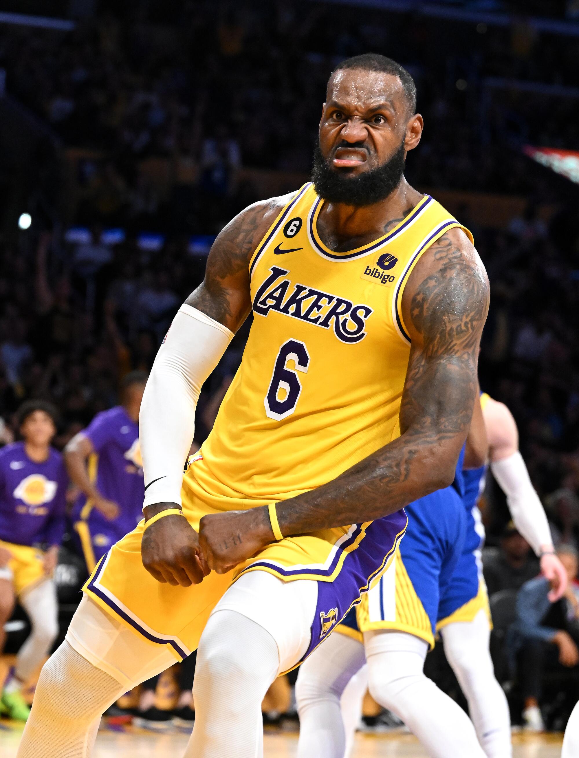 Lakers star LeBron James celebrates after scoring against the Warriors in the third quarter of Game 6.