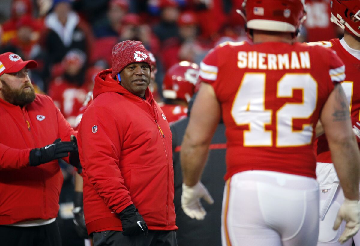 Kansas City Chiefs offensive coordinator Eric Bieniemy watches players before the AFC championship game.