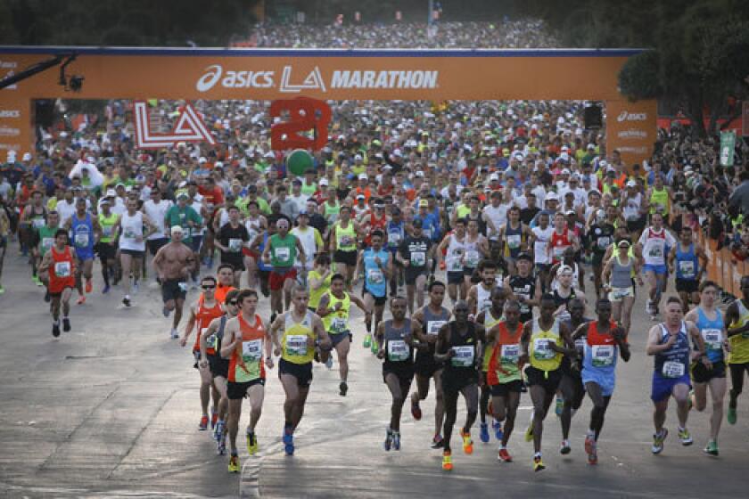Runners start the 2013 ASICS L.A. Marathon at Dodger Stadium.