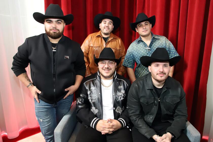 Grupo Frontera, from top left, Julian Pena Jr., Carlos Guerrero and Alberto Acosta, lower left, Adelaido "Payo" Solis III and Juan Javier Cantu, pose for a picture during a press conference at the Microsoft Theater in Los Angeles on, Thursday, February 16, 2023. Grupo Frontera announced it's 'El Comienzo' tour across the U.S. with the band playing 20 cities starting this spring. (Photo by James Carbone