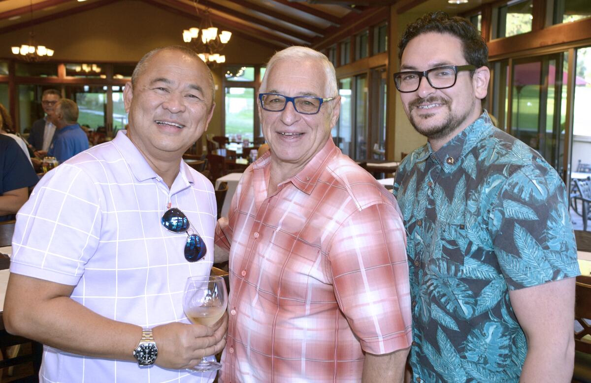 Among the 100-plus who mixed and mingled at the chamber’s mixer were Ronald Reyes of Pickwick Gardens Conference Center, from left, Barry Gussow of Keller Williams Realty, Inc., and Albert Hernandez of Family Promise of the Verdugos.