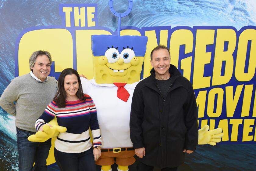 From left, Adam Goodman, Annie Laks and Bob Bacon pose for a photo with Spongebob at the world premiere of "The SpongeBob Movie: Sponge Out Of Water 3D" in New York City.