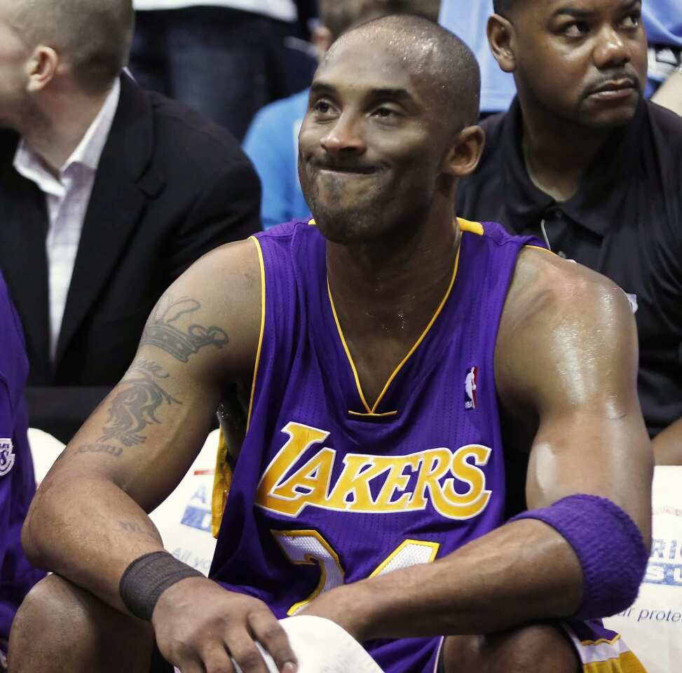 Kobe Bryant can only grimace in the fourth quarter Saturday night as the Jazz pull away to a victory over the Lakers.