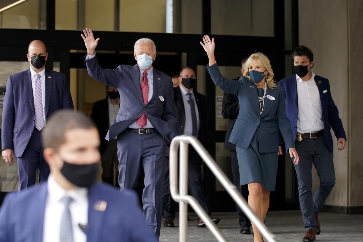 Democratic presidential candidate Joe Biden and his wife Jill Biden wave in Wilmington, Del.