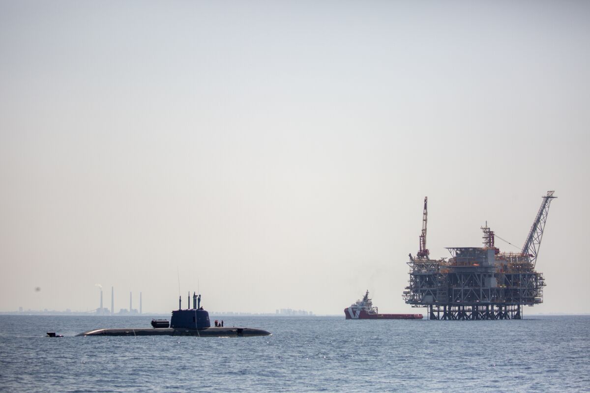 FILE - An oil platform in Israel's offshore Leviathan gas field is seen from on board the Israeli Navy Ship Atzmaut as a submarine patrols in the Mediterranean Sea , Sept. 1, 2021. Israel signed a three billion euro ($3.4 billion) deal on Thursday, Jan. 20, 2022, to buy three cutting edge submarines from Germany, the defense ministry announced. The Dakar-class diesel-electric submarines will be produced by German manufacturer Thyssenkrupp and are expected to be delivered within nine years, the ministry said. (AP Photo/Ariel Schalit, File)