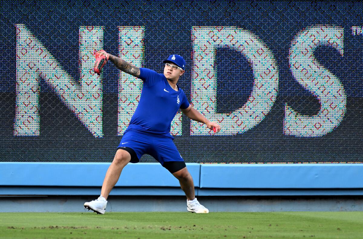 Dodgers pitcher Julio Urías throws during practice at Dodger Stadium on Monday.