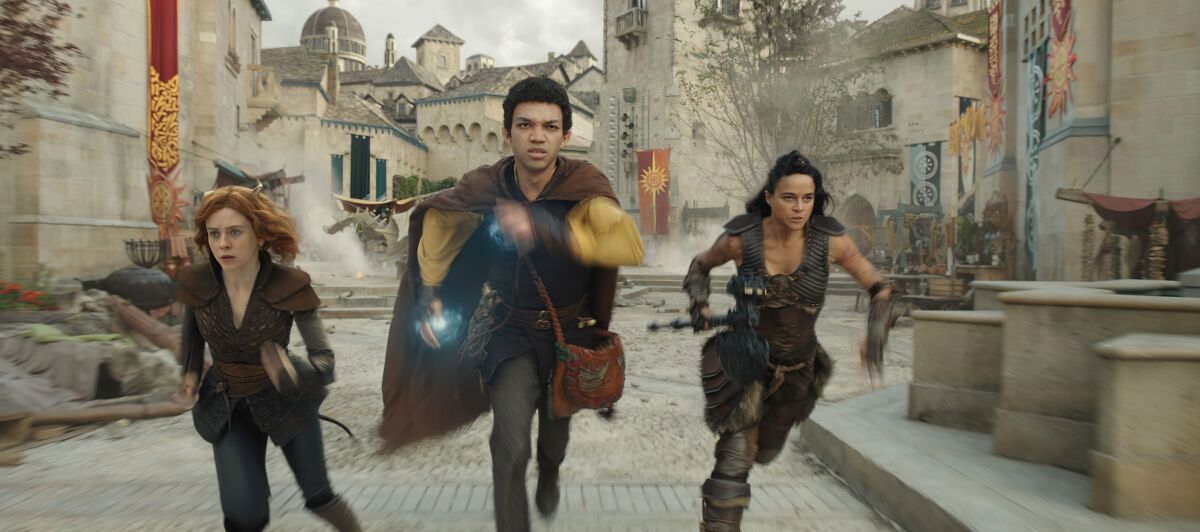 Sophia Lillis, Justice Smith and Michelle Rodriguez walk in "dungeons"