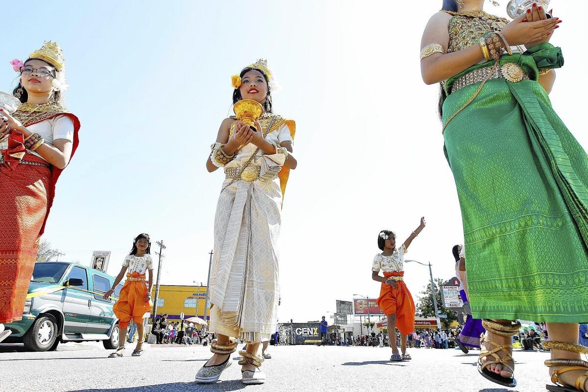 Participants in the Cambodian New Year parade in Long Beach march through Cambodia Town. Thousands of Cambodian Americans lined both sides of Anaheim Street for the start of the parade.