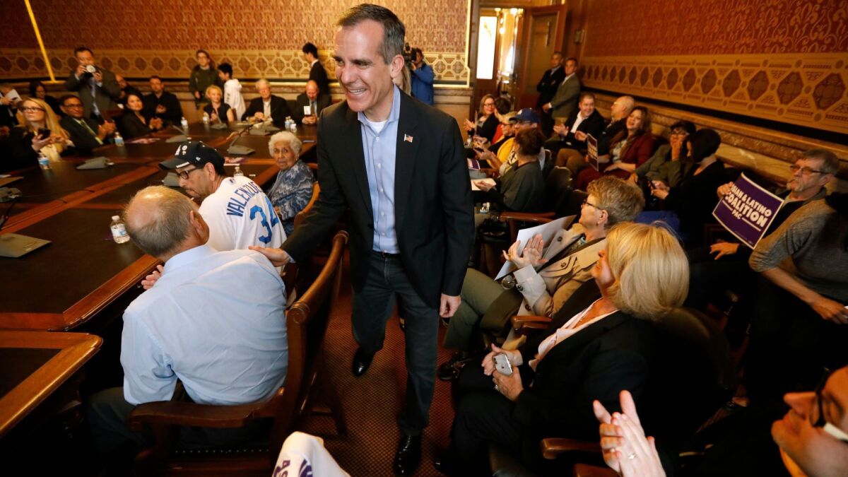L.A. Mayor Eric Garcetti arrives at a meeting with members of the Asian and Latino Coalition at the statehouse in Des Moines in April.