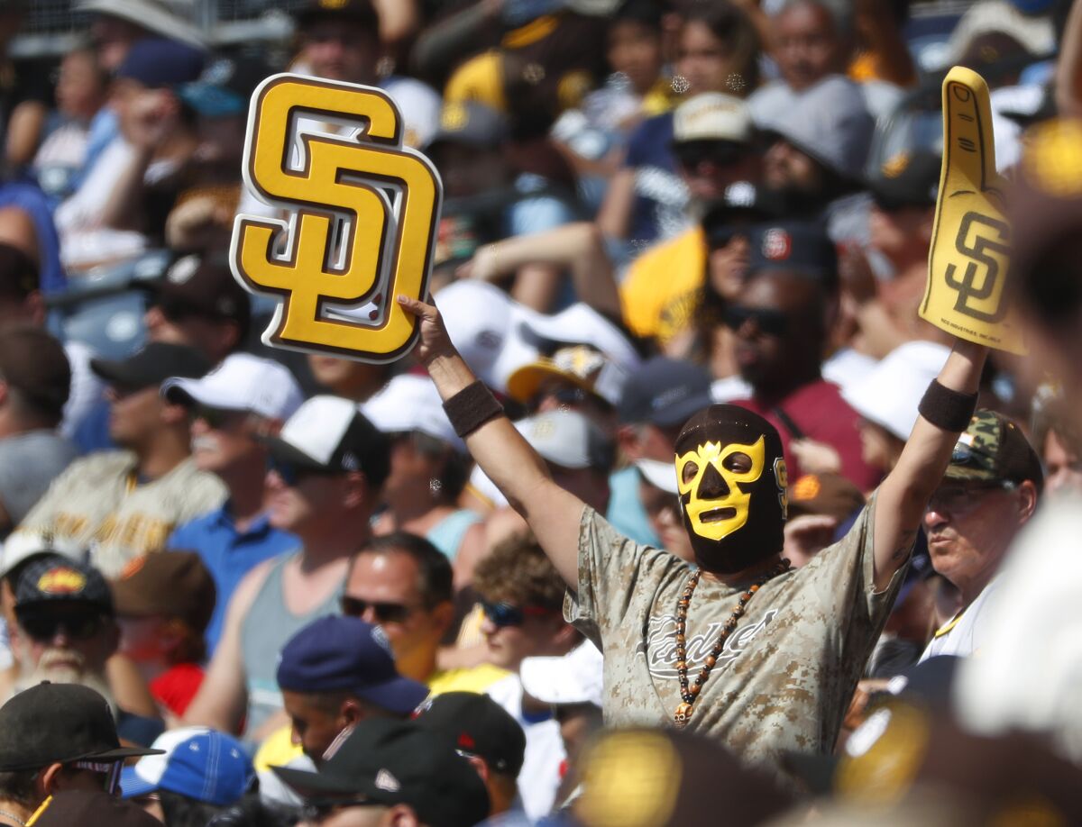 A fan cheers as the San Diego Padres played the Colorado Rockies