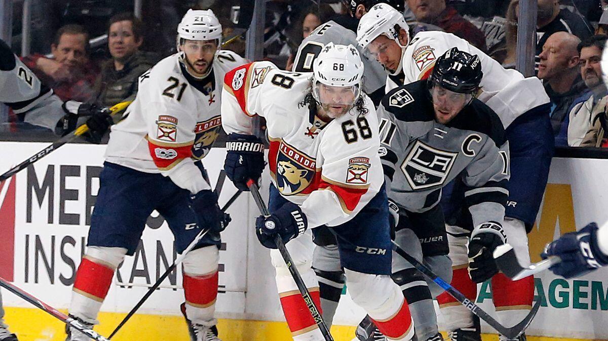 Florida Panthers right winger Jaromir Jagr (68) leads the pack in a scrum, with Kings center Anze Kopitar (11) right behind, during a Feb. 18 game at Staples Center.