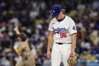 Dodgers pitcher Landon Knack hangs his head as Padres second baseman Jake Croneworth rounds the bases.