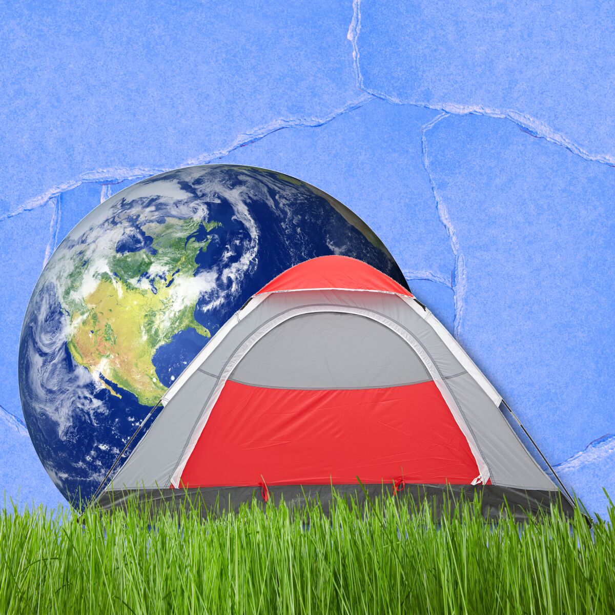 Camping tent on green grass with the globe behind it.