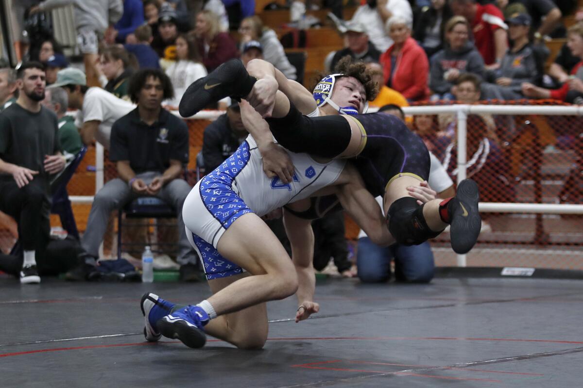 Fountain Valley's Max Wilner body slams his opponent in a 160-pound match during the CIF Southern Section Northern Division individual championships at Marina High on Feb. 15.