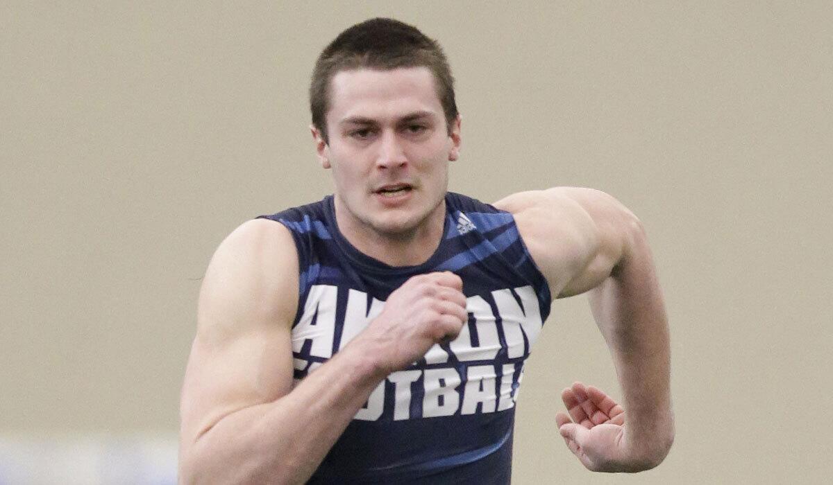 Akron's Andrew Pratt runs the 40-yard dash at a Pro Day college football workout at the University of Akron, Friday, March 18, 2016, in Akron, Ohio. (AP Photo/Tony Dejak)