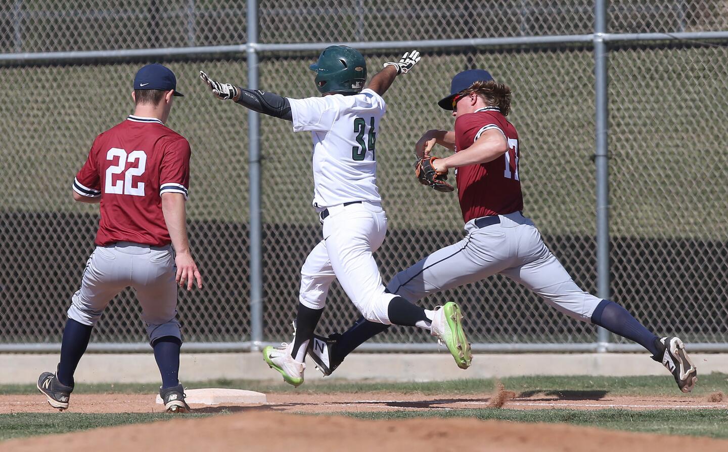 Sage Hill School's Ashwin Chona beats St. Margaret's Trey Pate to first base after an infield hit during a San Joaquin League baseball game at Sage Hill on Tuesday.