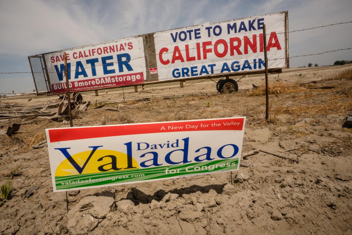 Signs on a corner of Highway 43 just north of Hanford, Calif.