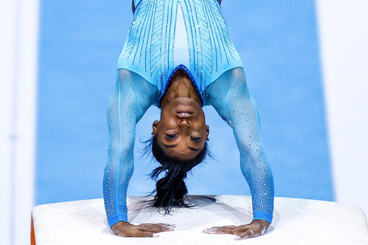 American Simone Biles pushes off on the vault and continues flipping through the air during a 2023 competition