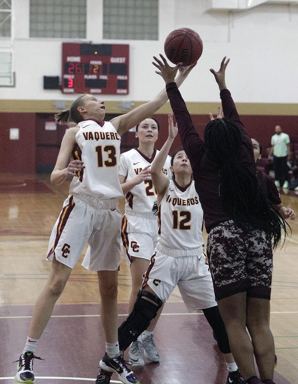 Glendale Community College's Polina Kovaleva reaches out for a rebound against Antelope Valley's Erin Williams in a Western State Conference women's basketball game at Glendale Community College on Wednesday, January 22, 2020.