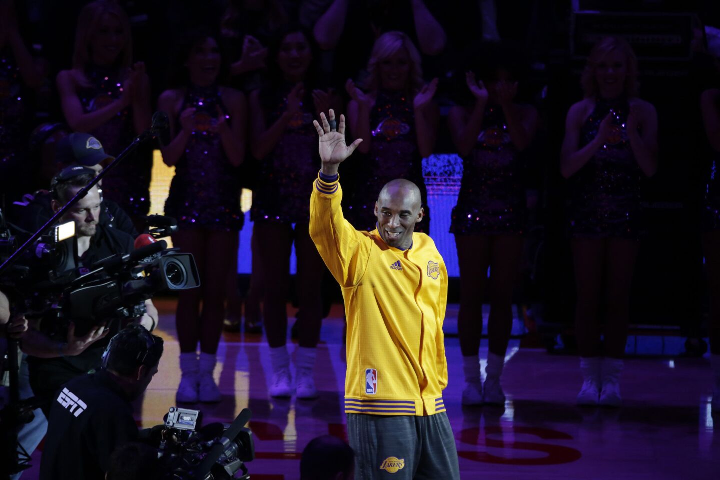 Kobe Bryant acknowledges the Staples Center crowd during a pregame ceremony.