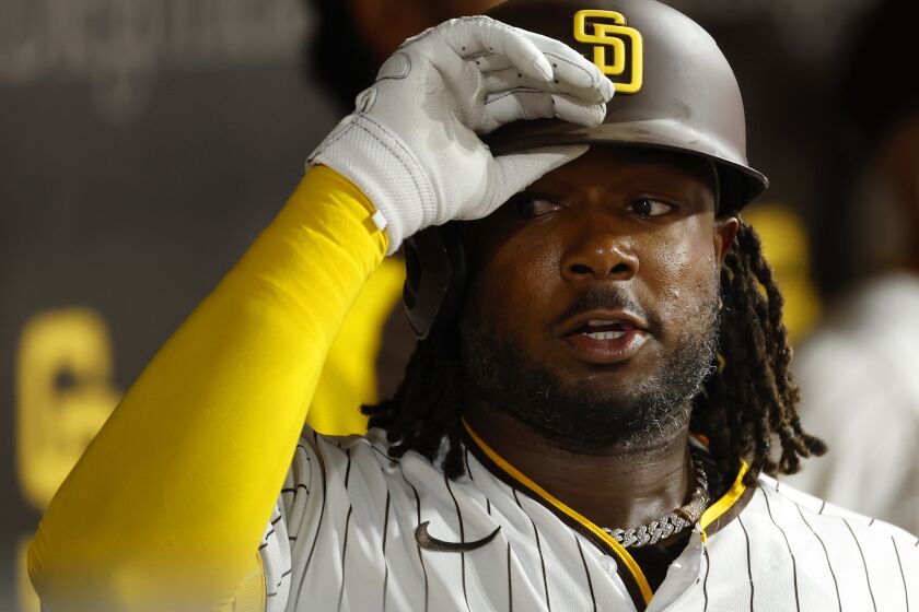SAN DIEGO, CA - SEPTEMBER 6: San Diego Padres' Josh Bell celebrates in the dugout after hitting a home run in the seventh inning against the Arizona Diamondbacks at Petco Park on Tuesday, September 6, 2022. (K.C. Alfred / The San Diego Union-Tribune)