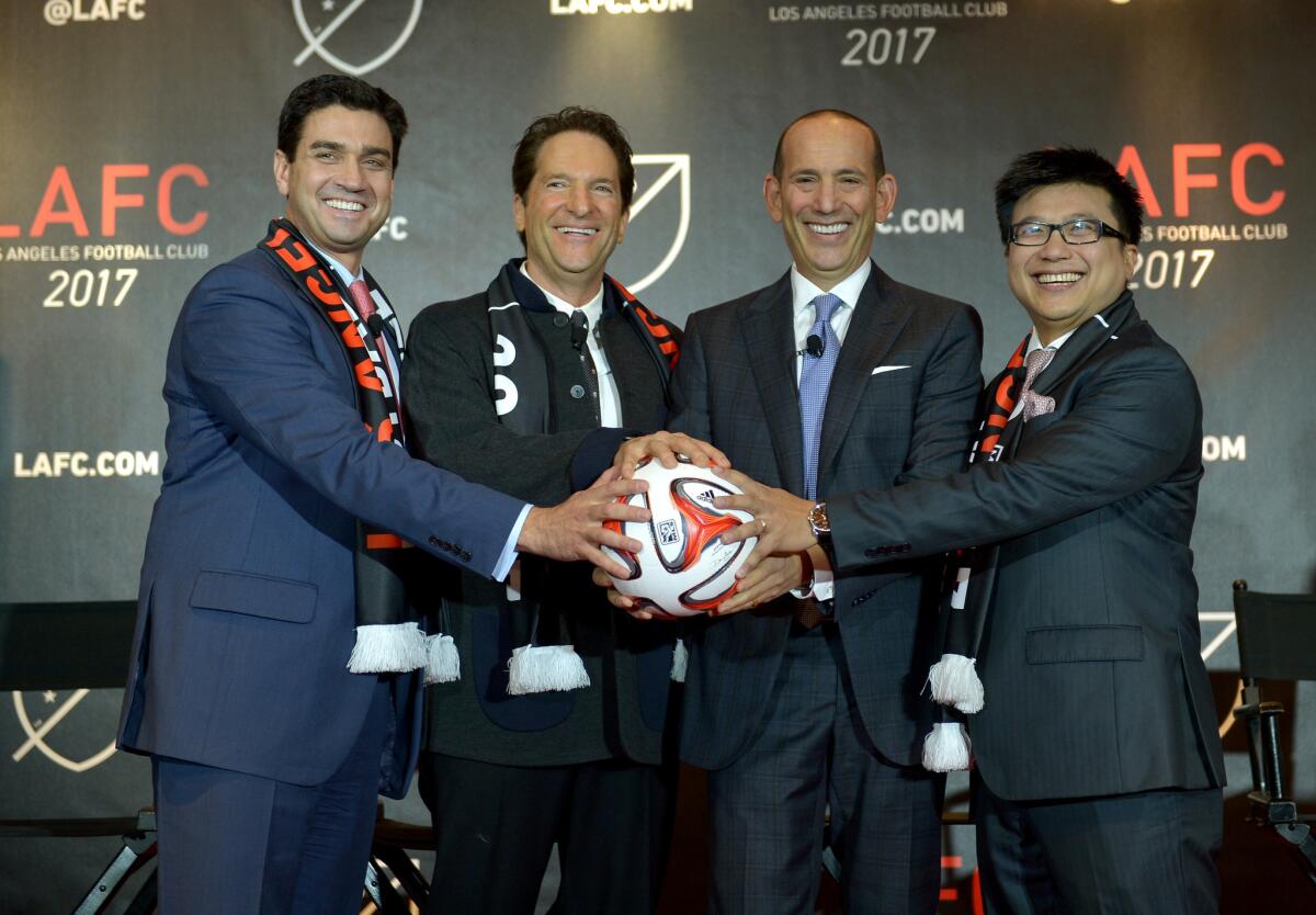 MLS Commissioner Don Garber, second from right, joins Los Angeles Football Club co-owners Tom Penn, left, Peter Guber and Henry Nguyen at a news conference in 2014.