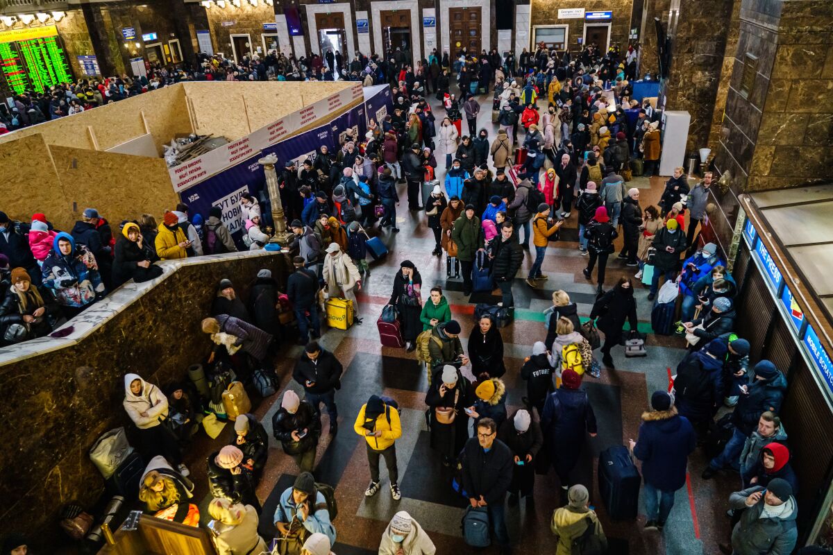 Hundreds of people gather at the Kyiv train station trying to get out of town