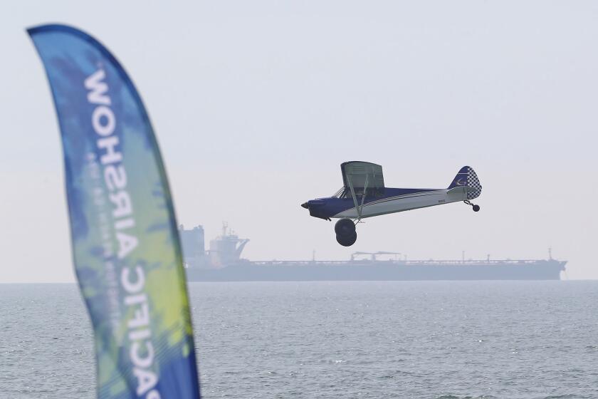 A Short Landing and Take-off aircraft better known as a STOL plane, makes a pass during the Pacific Airshow press conference on the beach at the end of Huntington St. in Huntington Beach on Thursday. The STOL is popular with Alaska bush pilots because of their ability to land on short runways or water with minimal effort. The planes will be featured in the 2024 Pacific Air Show. This year, the Pacific Airshow will build a temporary runway on the sand for touch and go landings to entertain the crowd.