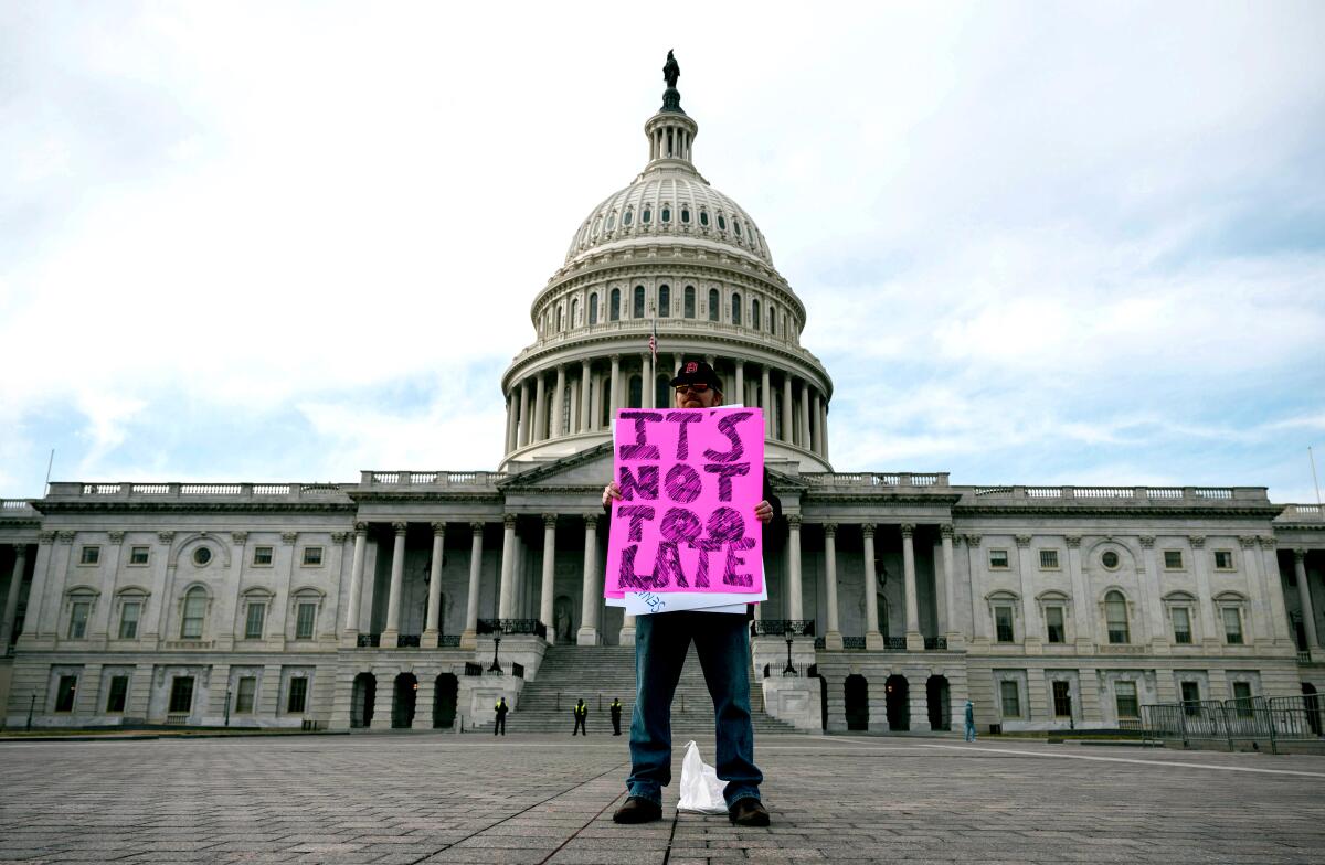 A protester in front of the Capitol on Feb. 1.