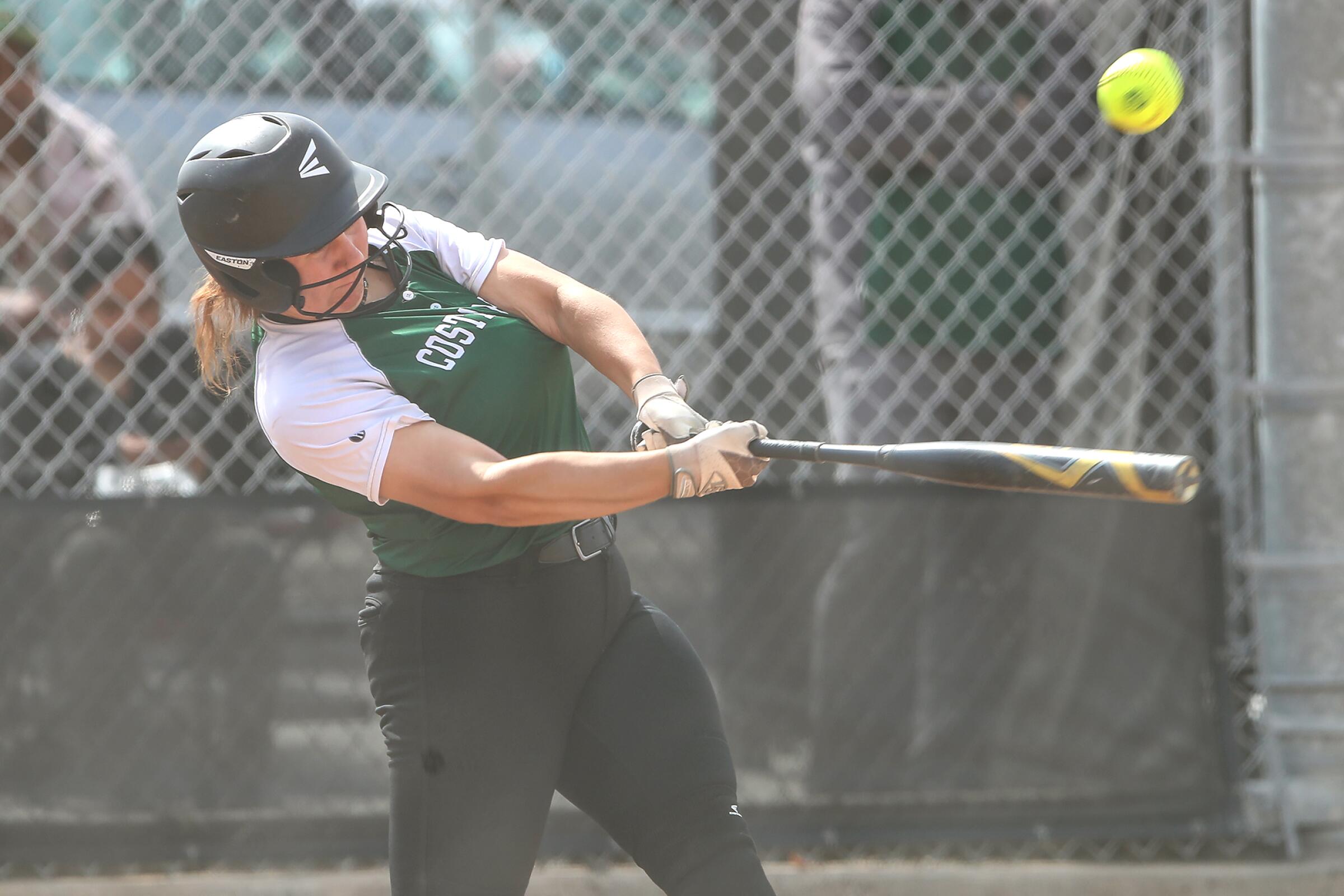 Costa Mesa's Sydnie Pulido hits a single in the first round of the CIF Southern Section Division 6 softball playoffs against Pasadena Mayfield on Thursday.