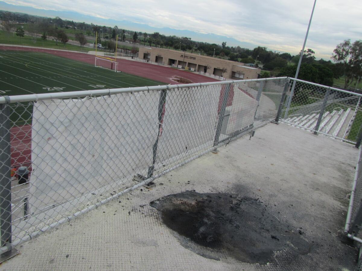 A burning plastic table damaged the ceiling of Jim Scott Stadium's press box early Friday, according to Costa Mesa firefighters. The incident is being classified as suspicious.