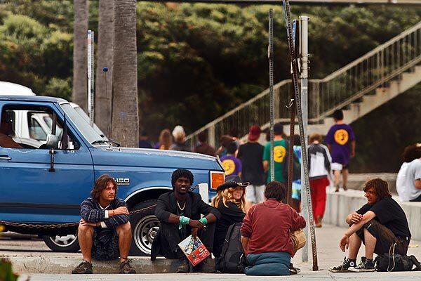 Young transients gather at the corner of Abbott Street and Newport Avenue in the Ocean Beach area of San Diego. The laid-back neighborhood is being torn by a dispute over the emergence of a subculture of unkempt young males sleeping in doorways, urinating in public places and panhandling aggressively. The flash point was a bumper sticker reading: "Welcome to Ocean Beach. Please Don't Feed Our Bums."