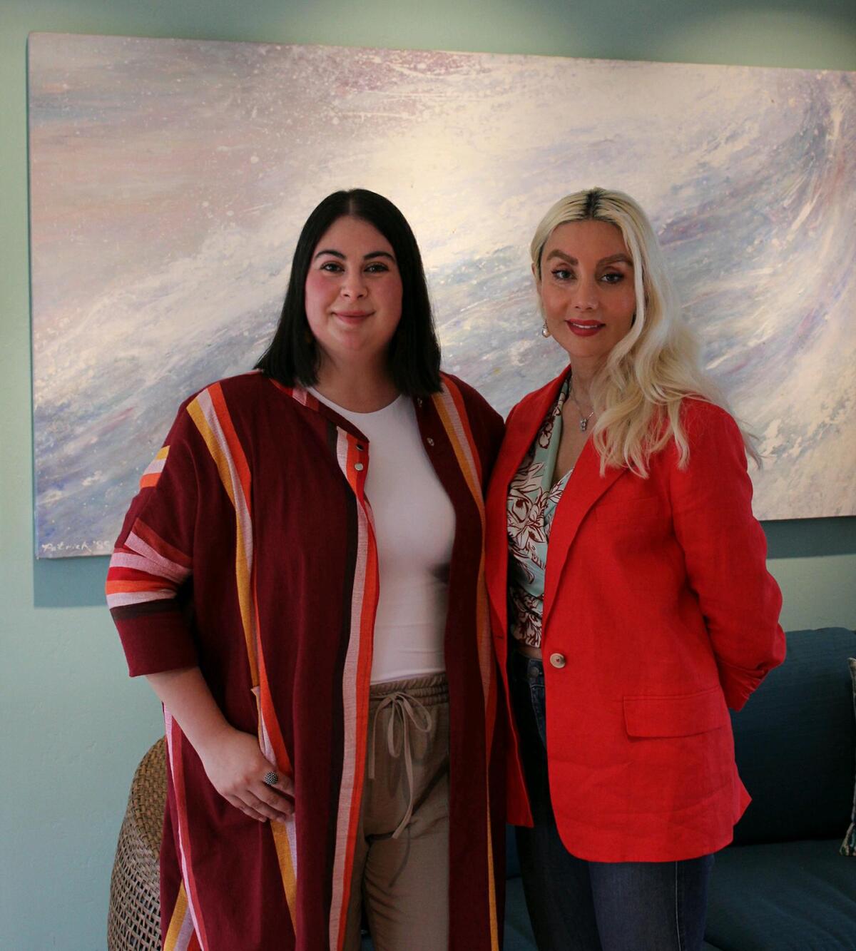 La Jolla Community Center Executive Director Nancy Walters (left) welcomes the center's newest board member, Symphony Moussighi.