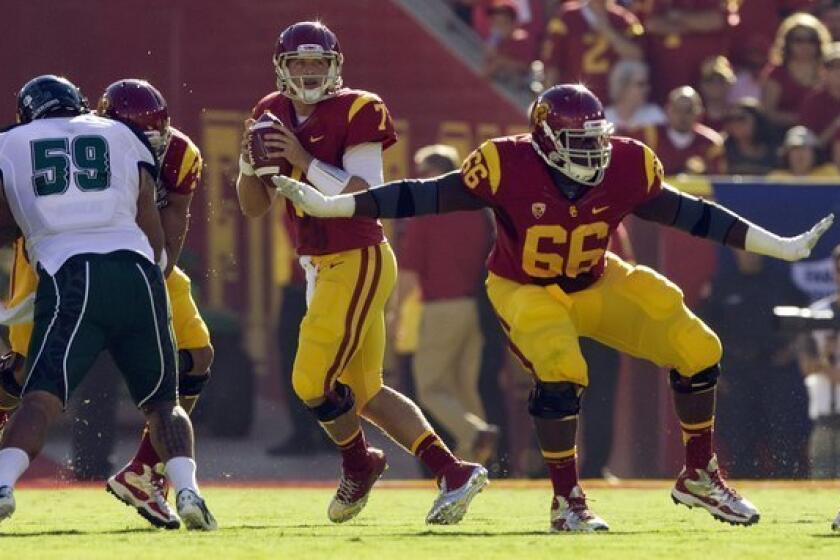 USC guard Marcus Martin (66) gives quarterback Matt Barkley (7) plenty of time to look for an open receiver against Hawaii on Sept. 1.