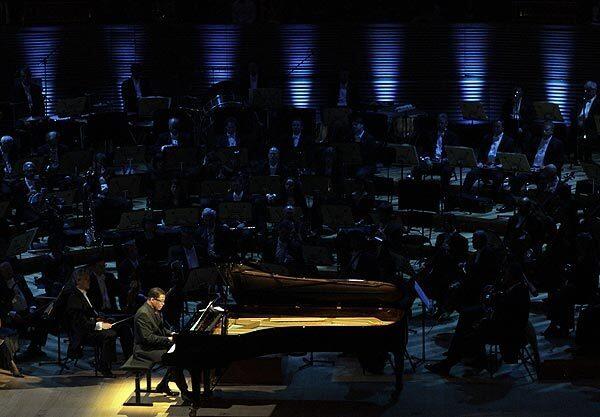 Herbie Hancock performs George Gershwin's "Rhapsody in Blue" with the Los Angeles Philharmonic Orchestra at Walt Disney Concert Hall during its opening gala.