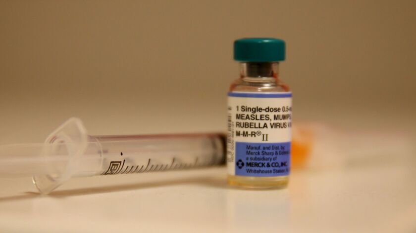 A bottle containing a measles vaccine.