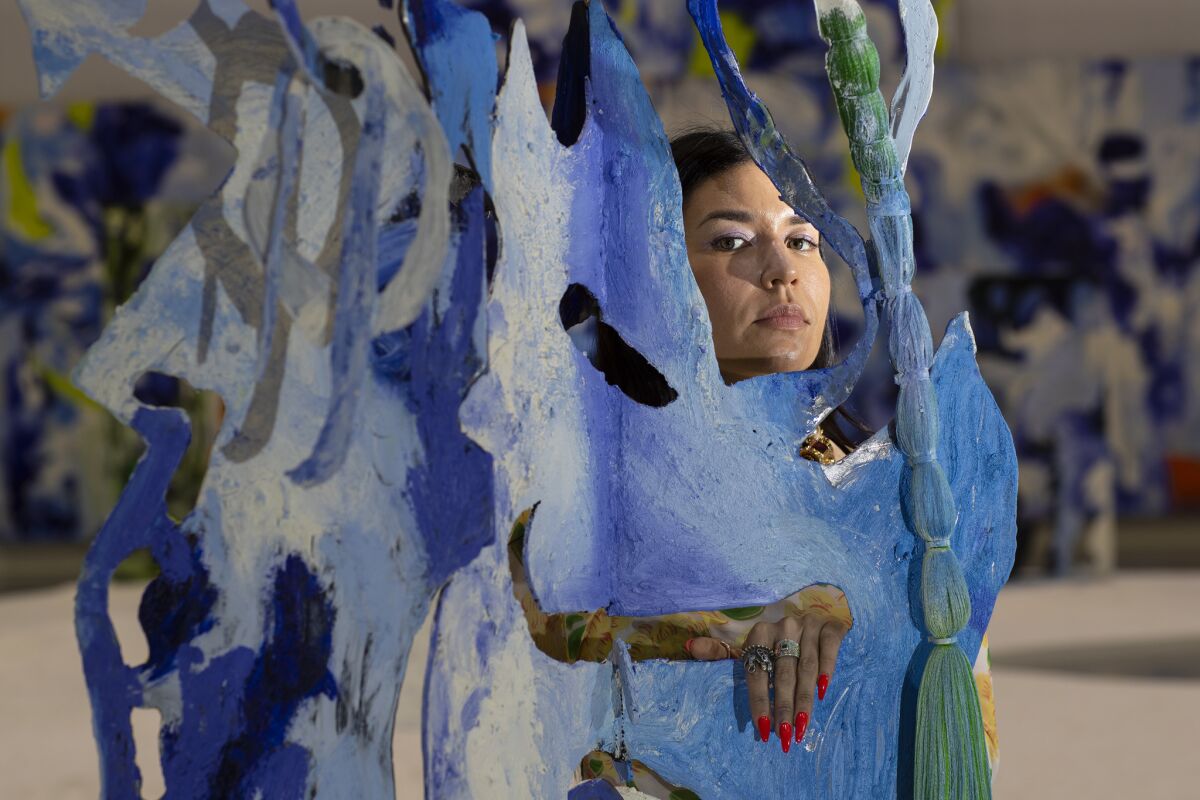 Artist Donna Huanca, photographed in her "Obsidian Ladder" installation, at the Marciano Art Foundation in L.A.