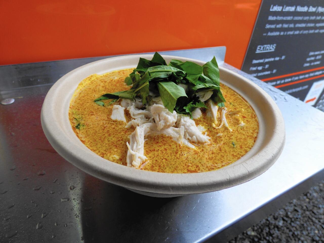 Laksa lemak, a noodle dish of the Baba-Nyonya people from the western coast of Malaysia is made rich and smooth with coconut milk.