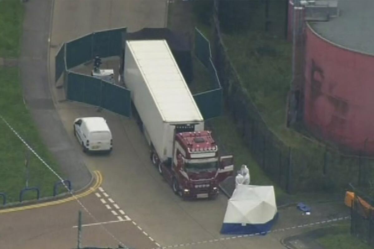 Forensic officers are pictured at the scene after 39 people were found dead in a truck Oct. 23 in Thurock, southern England.