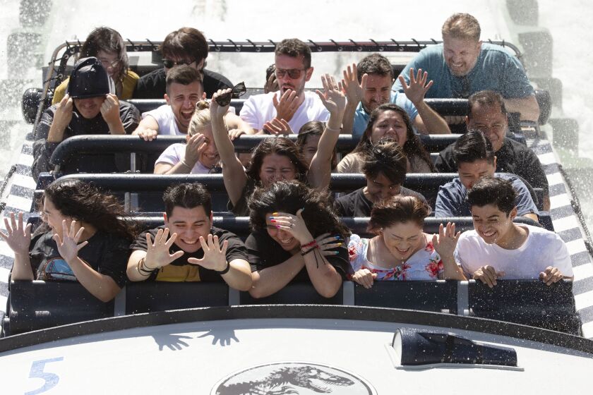 UNIVERSAL CITY, CALIF. - JULY 17, 2019: Riders enjoy the newly opened Jurassic World ride at Universal Studios Hollywood in Universal City, Calif. on Wednesday, July 17, 2019. (Liz Moughon / Los Angeles Times)