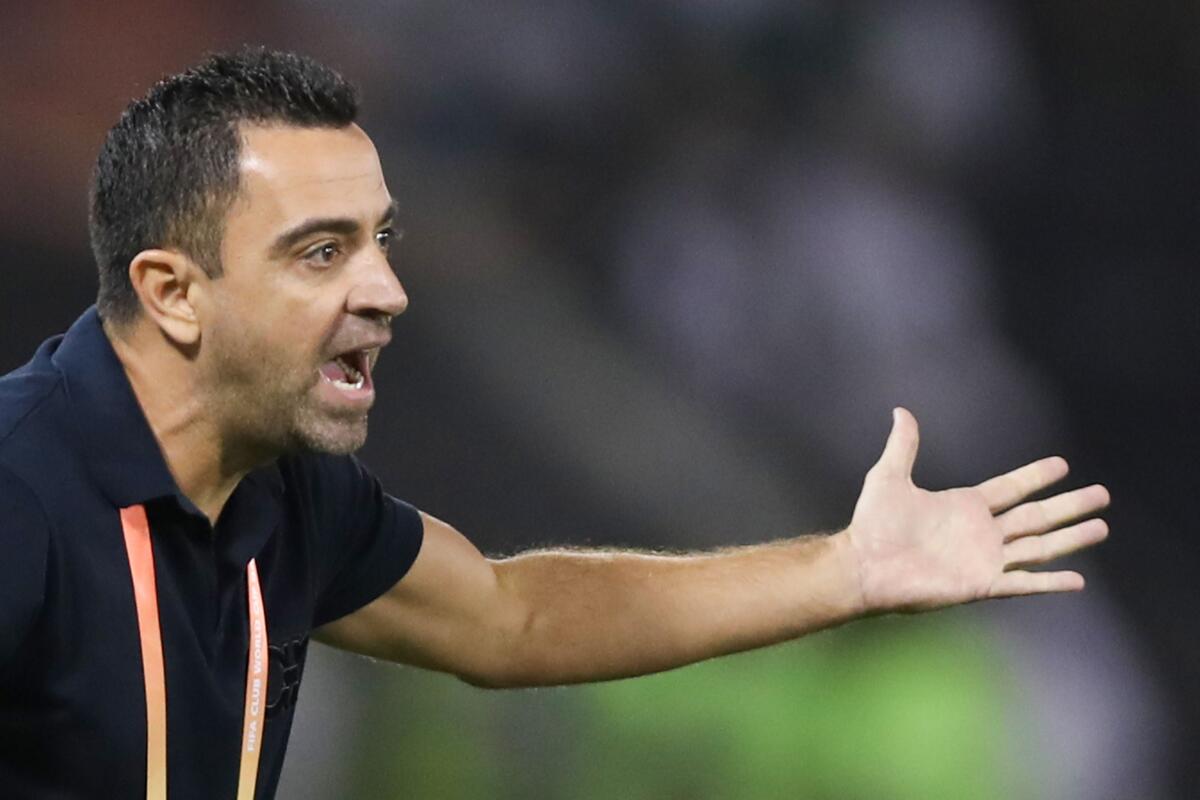 Sadd's coach Xavi speaks to his players during the 2019 FIFA Club World Cup quarter-final football match between Monterrey and al-Sadd at Jassim Bin Hamad Stadium in Doha on December 14, 2019. (Photo by KARIM JAAFAR / AFP) (Photo by KARIM JAAFAR/AFP via Getty Images) ** OUTS - ELSENT, FPG, CM - OUTS * NM, PH, VA if sourced by CT, LA or MoD **